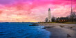 New Haven Landmark Lighthouse at the beachfront of Morgan Point Park, built in 1847 in Connecticut. Winter coastal landscape in New England at dramatic cloudy sunset in America.