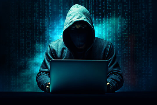 A hacker or scammer using laptop computer on dark technology background, phising, online scam and cybercrime concept.