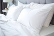 White pillows with blanket and duvet cover on the bed