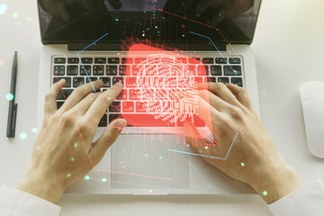 Aufkleber - Multi exposure of creative fingerprint hologram with hands typing on computer keyboard on background, personal biometric data concept