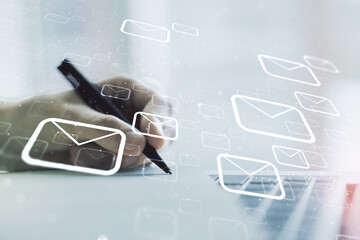 Poster - Double exposure of postal envelopes hologram with hand writing in notebook on background with laptop. Electronic mail and spam concept