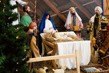 Nativity Scene With Holy Family: Baby Jesus, Blessed Virgin Mary, Saint Joseph, Angel And Three Wise Men And Sheep. Nativity. Decor In The Church.