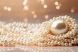  a close up of a pearl necklace on a white surface with a boke of white lights in the background.