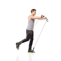 Wall Mural - Exercise, workout and resistance band with a young man in studio isolated on a white background for health. Gym, fitness or performance and a strong athlete training with equipment for wellness