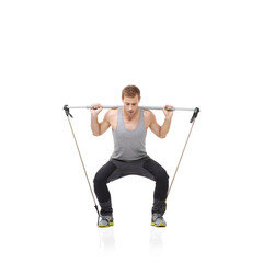 Wall Mural - Fitness, exercise and resistance band with a young man in studio isolated on a white background for health. Gym, workout or performance and a strong athlete training with equipment for wellness