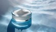 Glass container with white cosmetic cream on blue water surface. Side view of pot jar on fresh water. Beauty skin care concept. Background with copy space.