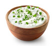 Wooden bowl of fresh sour cream dip sauce with herbs and green onions