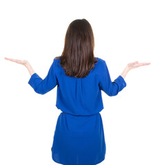 Wall Mural - behind rear view slim brunette woman in blue dress showing her two empty palms space on white png transparent background