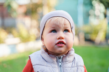 Wall Mural - Portrait of little baby child toddler outdoor, cold season