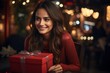 © ArtCookStudio - smiling young women with red gift box with smile on her face