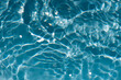 Bluewater bubbles on the surface ripples. Defocus blurred transparent white-black colored clear calm water surface texture with splash and bubbles. Water waves with shining pattern texture background