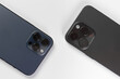 two smartphone cameras on a white background, , Iphone 15 pro max Black Titanium, iphone 12 pro max