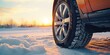 A detailed view of a car tire covered in snow. Perfect for winter-themed projects or illustrating driving in snowy conditions