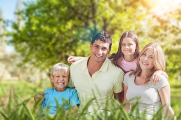 Wall Mural - Parents with cute child playing in park