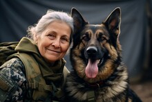 Portrait Of An Elderly Woman With Her Dog On The Background Of The Military Tent.