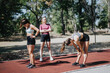 © qunica.com - Attractive Young Females Jogging Together in a City Park on a Sunny Day.