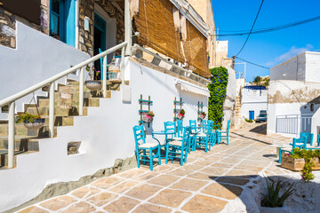 Naklejka na meble Tavern in narrow street with typical Greek style architecture in Kimolos village, Kimolos island, Cyclades, Greece