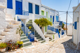 Fototapeta Uliczki - Narrow streets with typical Greek style architecture in Kimolos village, Kimolos island, Cyclades, Greece