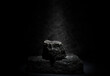 black granite for the pedestal stand. composition of stones on a dark background for product presentation