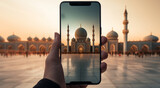Fototapeta  - Someone capturing an image of a mosque on their mobile phone. Ideal for illustrating modern technology and travel, or promoting tourism and cultural diversity in Islamic countries.