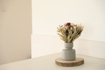 Canvas Print - Beautiful bouquet of dry flowers on white table indoors, space for text