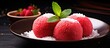 A Chinese dessert called lo mai chi or nuomici, is a sweet and chewy glutinous rice ball with strawberry filling and coconut coating.