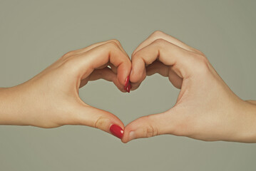 Heart from hands. Love, friendship concept. Man and woman hand in heart form love. Sign heart by fingers. Love on Valentine day. Two human hold hand gesturing heart shape symbol. Love sign. Charity.