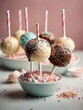 candy in a glass bowl, Delicious cake pops decorated with frosting chocolate and sprinkles