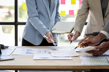 Investment Consultant, Asian business adviser meeting to analyze and discuss the situation on the financial report in the meeting desk office .Financial advisor and accounting concept