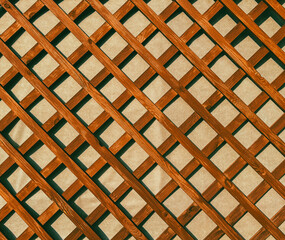 Sticker - Wooden lattice on the wall as an abstract background. Texture