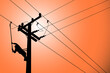 Silhouette of power lineman closing a single phase transformer on energized high-voltage electric power lines.	

