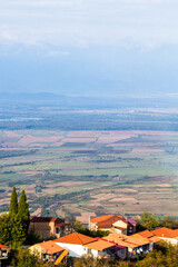 Sticker - travel to Georgia - Sighnaghi town houses over Alazan plain in Kakheti region in Georgia at autumn sunset