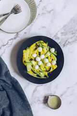 Wall Mural - Healthy salad with fresh zucchini, mini mozzarella balls and hot chilli pepper