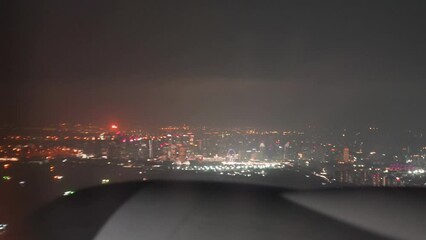 Wall Mural - Night view of Singapore skyline from a departing flight