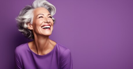 Wall Mural - Smiling elderly Grey woman with developing hair and smile on purple background