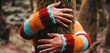 Woman hands bonding hugging tree trunk in the nature woods forest. Wearing colorful sweater. Concept of love nature healthy lifestyle. Environment and trees protection. Outdoor leisure activity people