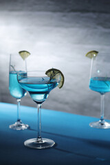 Glasses with blue alcohol cocktail ready for a party