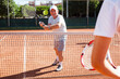 Mature sportsman playing at tennis court