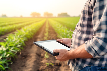 Close up farmer checking agriculture quality by using tablet and technology to control. Smart farm. Agro business.