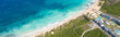 Macao beach with sandy coastline, turquoise water and stone cliff. Famous seashore for surfing in Dominican Republic. Aerial drone view . Long banner