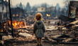 Little girl standing alone amidst the devastation of a burnt neighborhood, looking at the ruins and destroyed homes