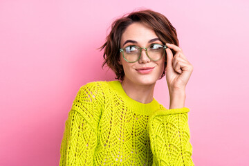 Poster - Photo of young thoughtful lady in yellow knitwear touch glasses planning looking interested novelty isolated on pink color background