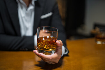 Wall Mural - Barman pouring whiskey whiskey glass..