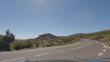 First Person View, FPV, From Dashcam Of Car Driving Mountain Road From Calar Alto Observatory To Tabernas Desert In Almeria, Andalusia, Spain, Europe. Road Trip In POV, With Motorbike Passing By