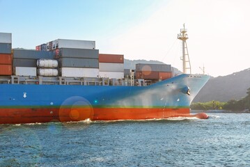 Container ship sailing in the sea of the Port of Santos channel. Santos city, Brazil.