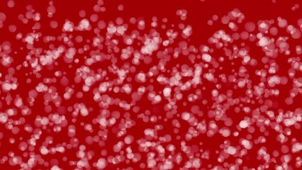 Wall Mural - Christmas bokeh particles falling over elegant red background. High quality 4k footage
