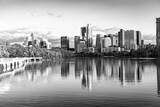 Fototapeta Miasto - skyline of Austin in early morning light with mirroring city in the colorado river, Texas