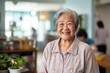 Smiling portrait of happy senior woman in nursing home