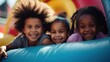 group of african american curly cute smiling children on inflatable bright colored playground on inflatable trampoline AI