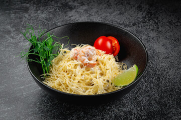 Poster - Pasta carbonara with shrimp in dark plate